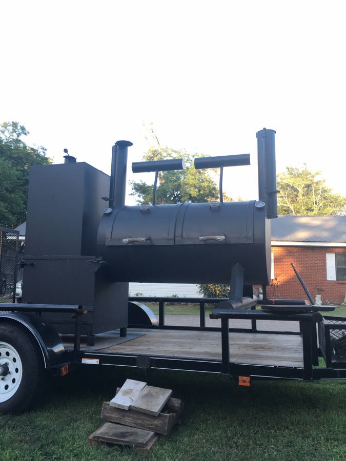 The Quessenberry competition rig: a black offset smoker on a trailer, built by Helmets to Hardhats in Memphis